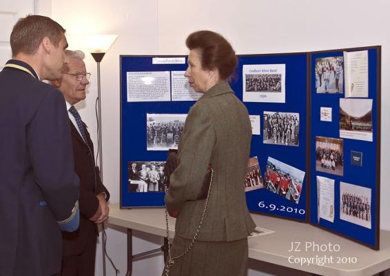 Alan Court, Peter McLeish and Princess Anne discuss the history of the Silver Band