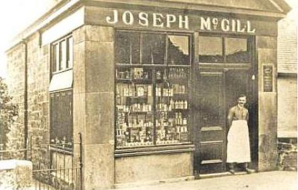 Joe McGill outside his shop