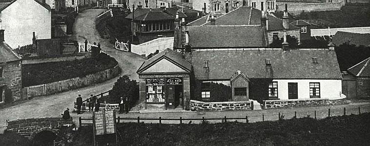 Joe McGill outside his shop