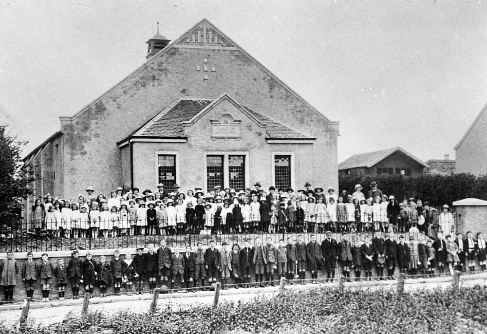 Sunday School outside rebuilt church in 1920s